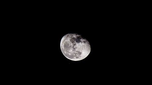 Low angle view of moon against sky at night
