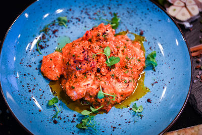 High angle view of meat in plate on table