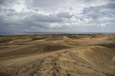 Scenic view of desert against sky