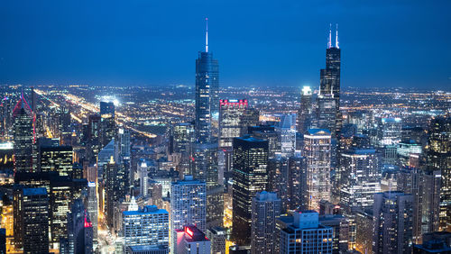 Illuminated buildings in city at night