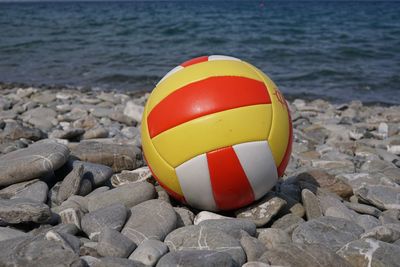 Beach volleyball on a stone beach