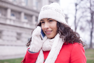 Portrait of a smiling young woman in winter