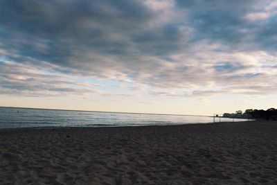 Scenic view of beach against sky during sunset