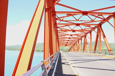 Bridge over sea against sky