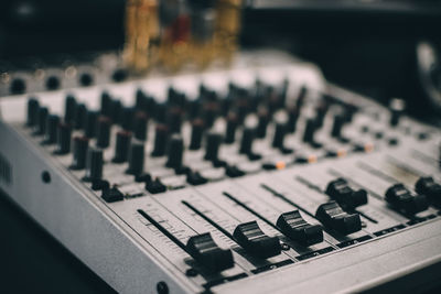 Close-up of sound mixer in recording studio