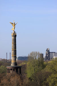 Statue of historic building against clear blue sky