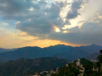 Scenic view of mountains against sky during sunset