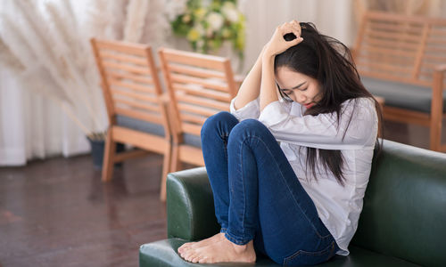 Young woman sitting on chair