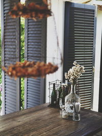 Close-up of flower vase on table at home