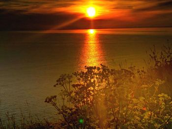 Scenic view of sea against sky during sunset