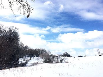 Scenic view of landscape against cloudy sky