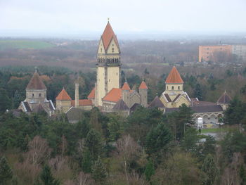 High angle view of trees and buildings against sky