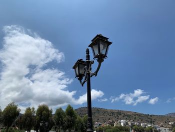 Low angle view of street light against sky