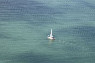High angle view of sailboat sailing on sea