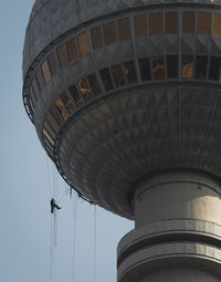 Low angle view of water tower against clear sky