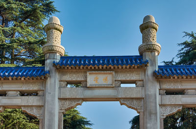 Low angle view of historical building against blue sky