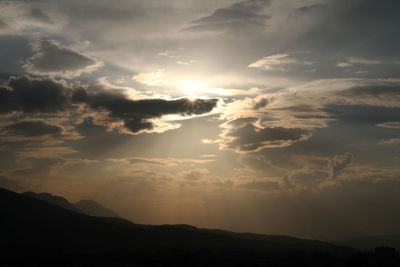 Low angle view of silhouette mountain against sky during sunset