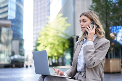 Businesswoman using mobile phone