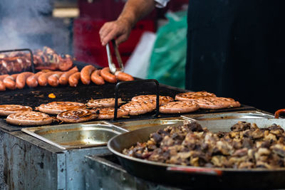 Midsection of man preparing food