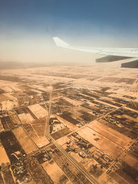 Aerial view of agricultural landscape against sky