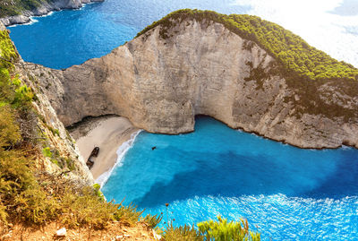 High angle view of rocks by sea