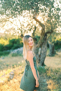 Young woman standing on field