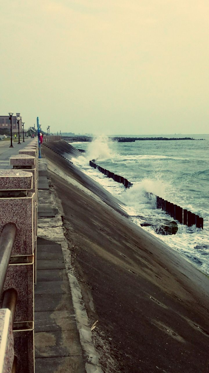 sea, water, beach, horizon over water, shore, clear sky, copy space, sand, tranquil scene, tranquility, scenics, beauty in nature, nature, the way forward, transportation, wave, sky, coastline, incidental people, surf