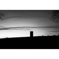 Low angle view of silhouette trees against sky at sunset