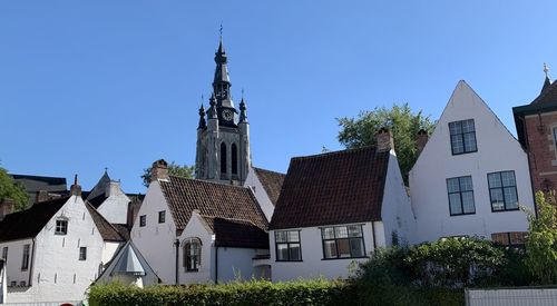 Residential buildings against blue sky