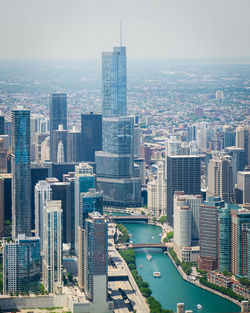 High angle view of buildings in city against sky trump building