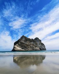 Scenic view of sea and rocks against sky