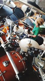 High angle view of boy playing piano