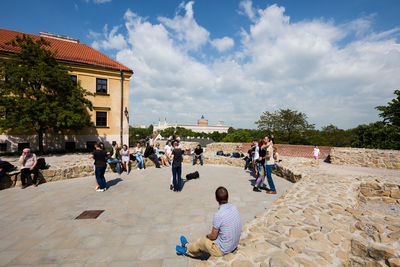 People at town square against sky