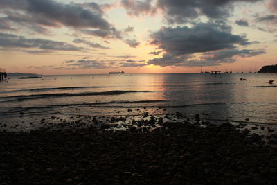 Scenic view of sea against sky at sunset