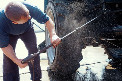 Low section of man working in workshop