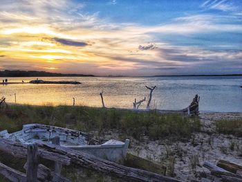 Scenic view of calm sea at sunset