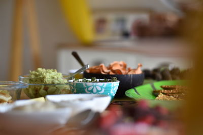Close-up of hand holding food on table