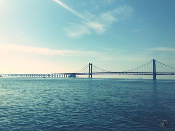 View of suspension bridge over sea