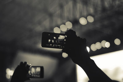 Concert crowd filming with smartphone