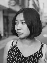 Portrait of young woman looking away