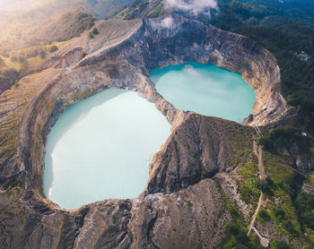 High angle view of sea amidst rock formations