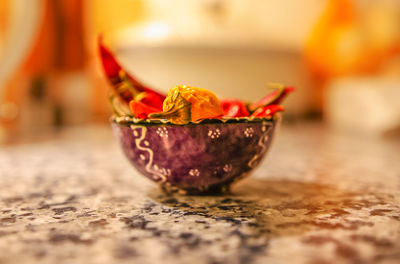 Close-up of lemon slice in bowl on table