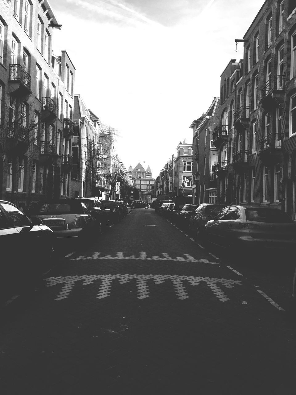 ROAD AMIDST BUILDINGS IN CITY