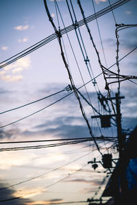 Low angle view of electricity pylon against sky