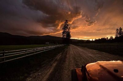 Scenic view of landscape against cloudy sky