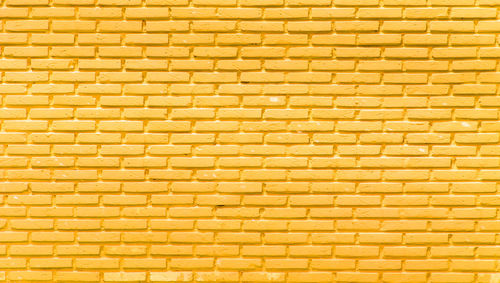 Full frame shot of yellow brick wall