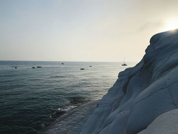 Scenic view of sea against clear sky during sunset