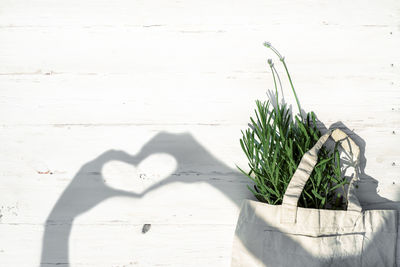 High angle view of heart shape on table against wall