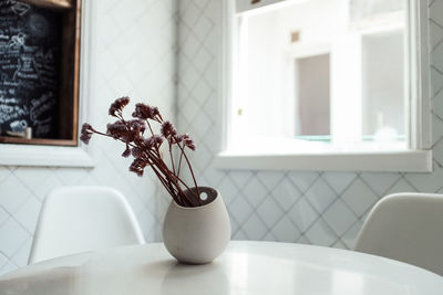 Flowers in vase on table at home