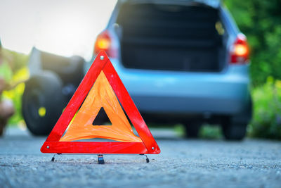 Close-up of red toy car on road